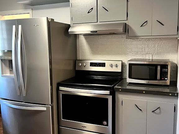 Kitchen appliances included- Fridge, stove/oven and microwave. Lots of cabinets.