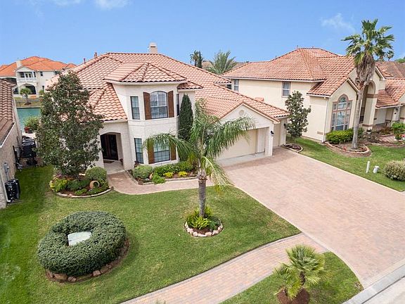 This six bedroom home (two on the first floor) has much to offer. Additions include a tankless water heater, automatic generator in case of power loss, an infinity edge swimming pool, spa, gas fire pit...the list goes on and on!
