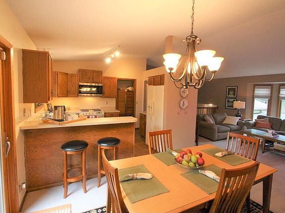 Floor the Ceiling Rock Fireplace create a cozy space during cooler days.