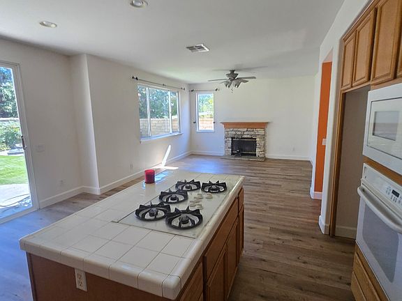Kitchen and Family Great Room. Built in microwave. Freshly painted Swiss coffee painted kitchen.