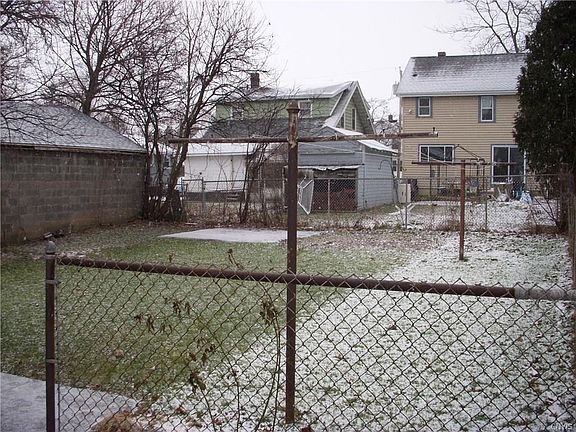 Fully Fenced Backyard, poured pad for shed