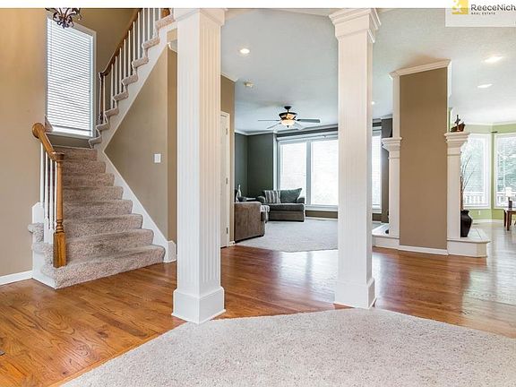 Wood floors begin at the entry and continue into the kitchen