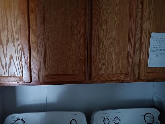 Laundry area with cupboard space