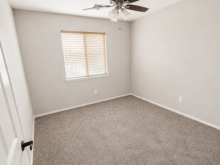 3rd Bedroom with closet, fan and window. All new carpets