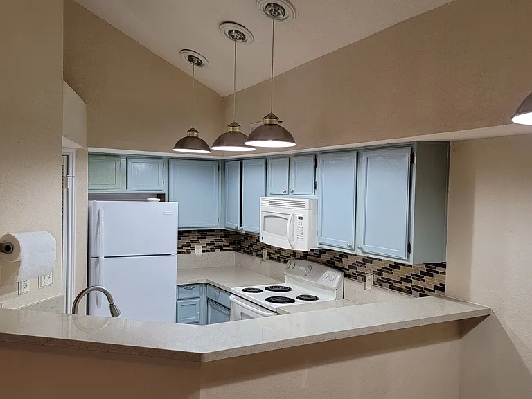 Plenty of counter spaces, with ceiling lights