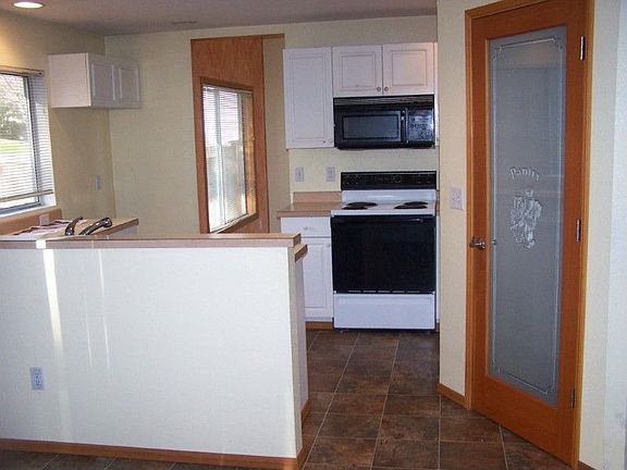 Looking into the kitchen and at the walk in pantry.