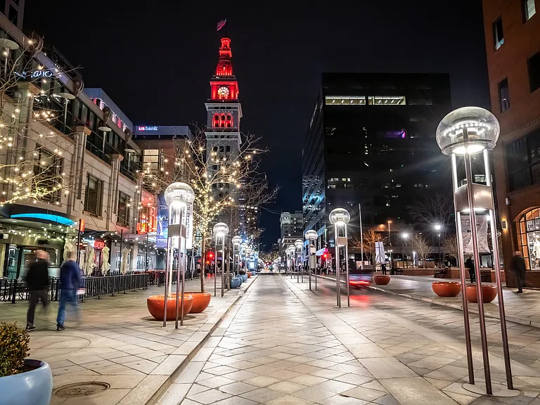 Stroll through Denver's lively streets, where charming lights illuminate the best spots for shopping and dining.