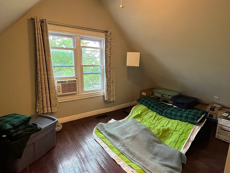 3rd floor west bedroom. The deflated air mattress in the photo is a double bed size. Could put a queen in here with small side tables.