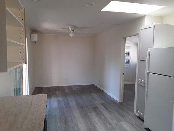 Living room with door leading to bedroom.