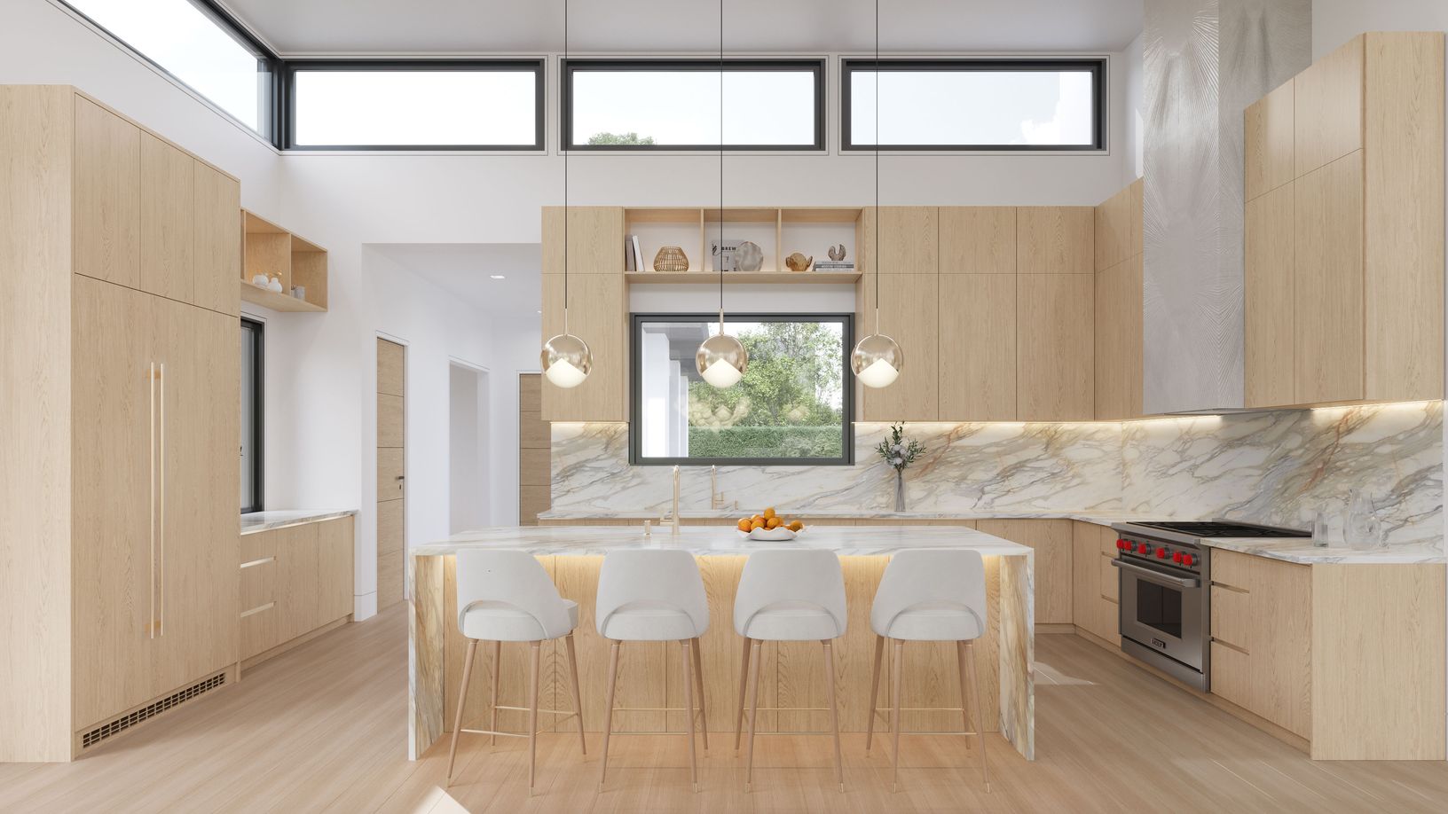 A sculptural waterfall marble island defines the kitchen, illuminated by warm brass pendants.