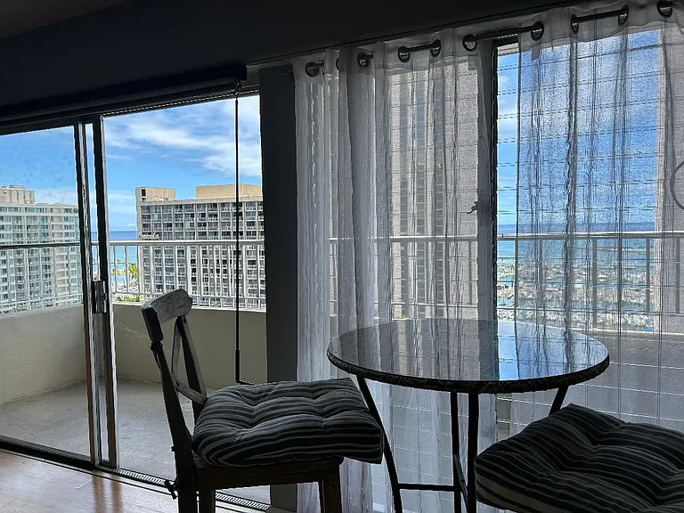 Views of Waikiki Beach and the Ala Wai Boat Harbor from Living Room. (Table and chair not included).