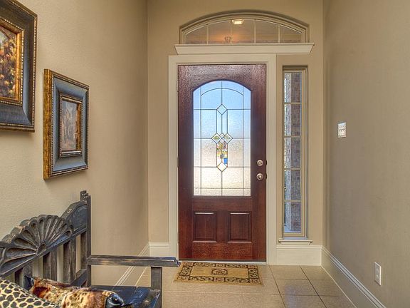 Lots of light coming in the entryway of this stunning home.