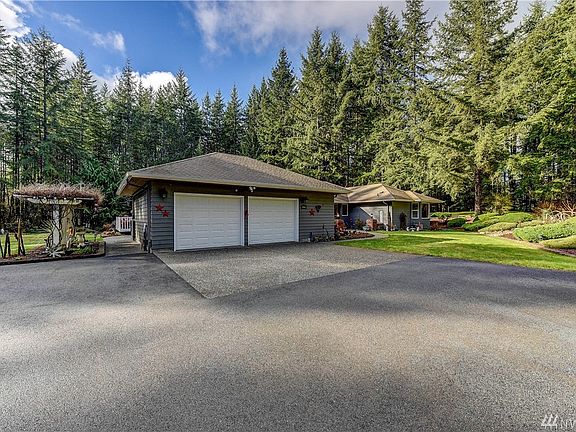 Lots of parking & an oversized 2 car garage with work space.