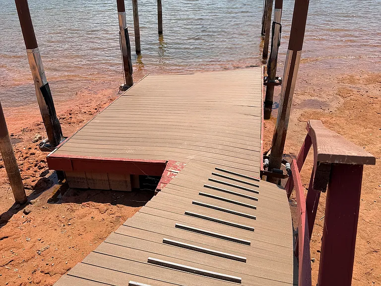 Steps from the dock to the water's edge for easy access to kayaking or paddleboarding.
