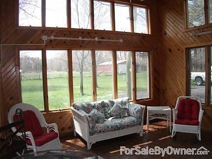 Master Bedroom
						:
						The spacious master bedroom opens to the sunroom through beautiful French doors.