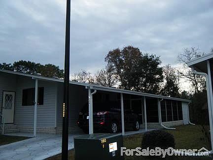 Side Entrance and Screen Porch
						:
						Side entrance and screen porch with accessible ramp for wheelchair or walkers.