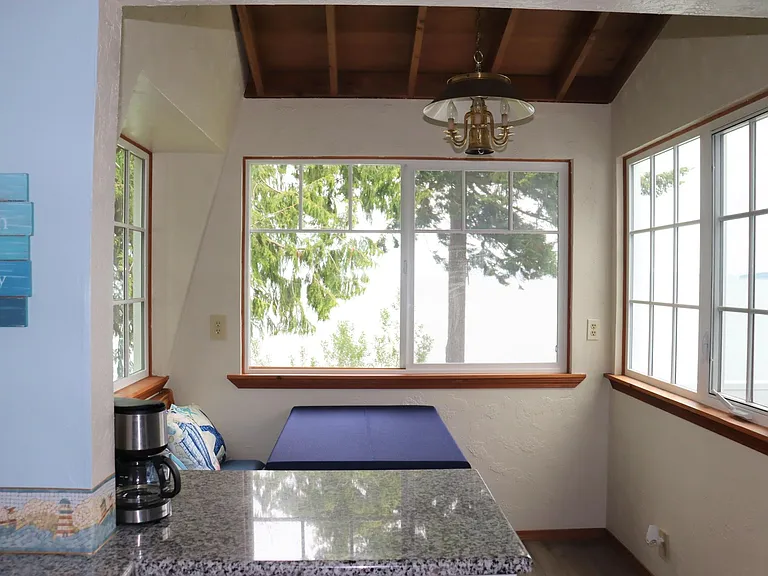 Cute dining area looks out onto Bay