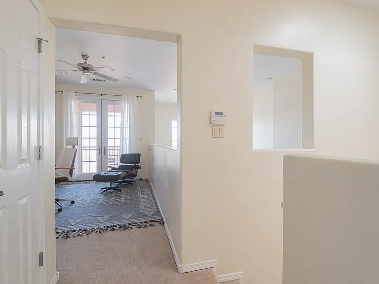 Third-floor landing leading to a flexible space, ideal for a home office or gym.