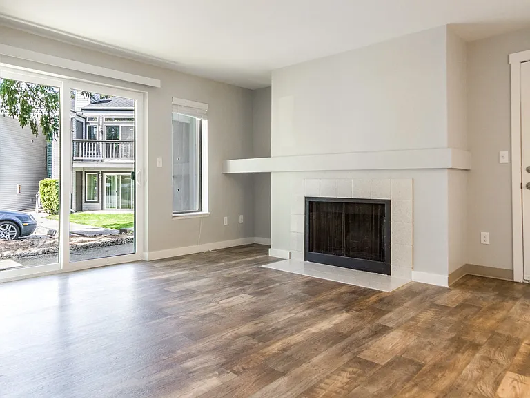 Novela Apartment Homes Living Room Fireplace and Patio Door