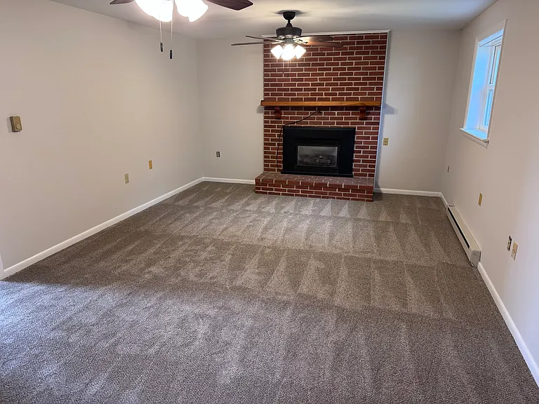 Basement family room with gas fireplace insert