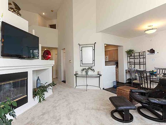 Living room, looking back toward rest of home. There are 2 bedrooms, full bath, and large laundry ro