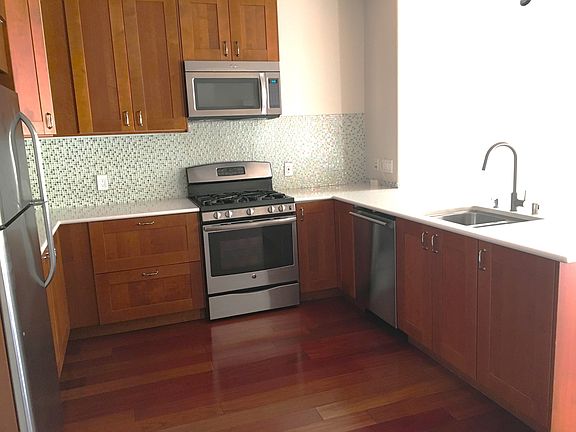Spacious kitchen and counter tops. Gas range, microwave, under-counter dishwasher and refrigerator.