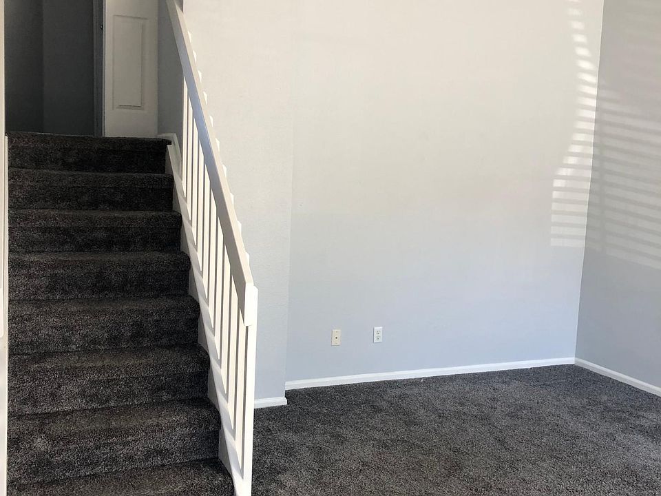 Entrance from front door into living room to the right