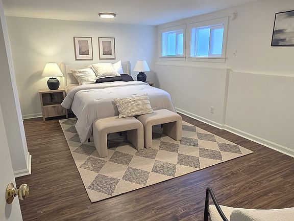Bedroom 1 staged with furniture- Apartment is unfurnished