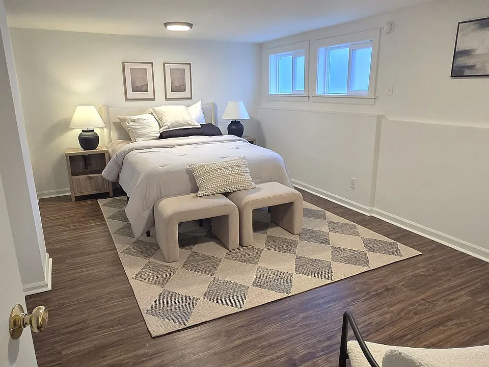 Bedroom 1 staged with furniture- Apartment is unfurnished