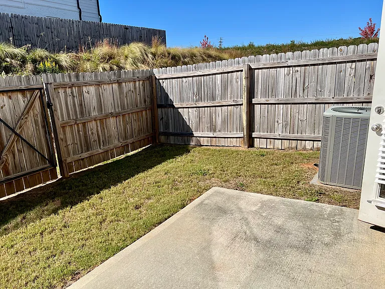 Fenced yard and patio, maintained by the HOA
