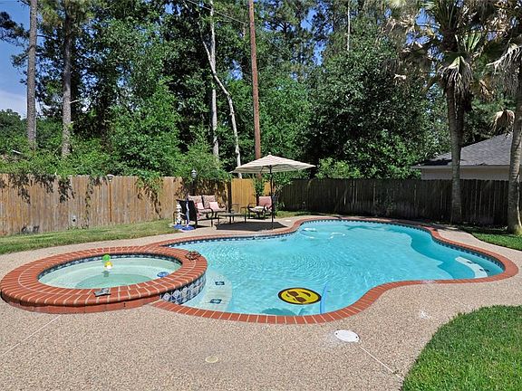 Lots of privacy in this pool back yard. It backs to trees then to a parking lot for a church. Listen to the birds all day long in this very quiet location.