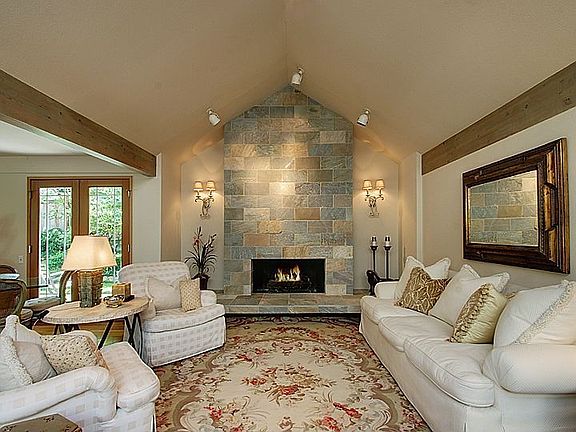 Vaulted Ceilings in Elegant Living Room with Custom Quartzite Stone Fireplace