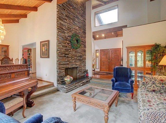 Another view of the living room. You can see the front door in the back ground.  The dining area and kitchen are to my left.