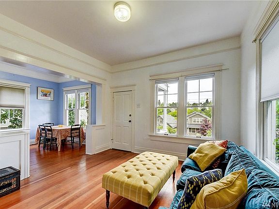Living room that opens up to the formal dining room with beautiful fir floors.