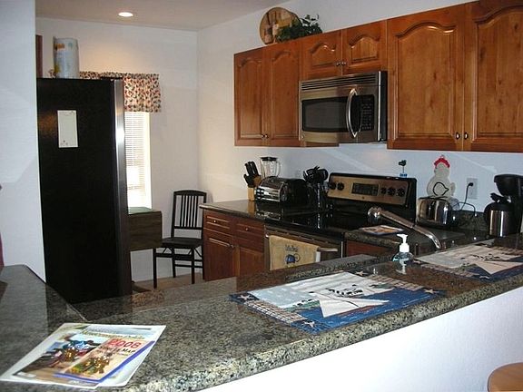 Kitchen with granite counter tops and stainless steel applia