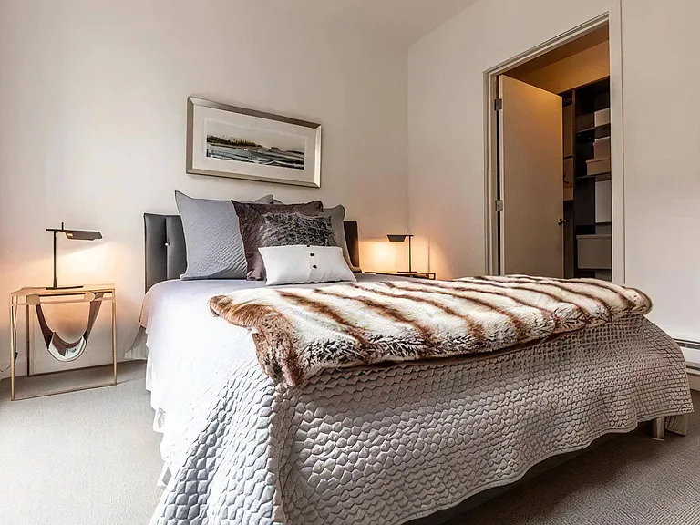 Apartment Bedroom with Walk-In Closet Entrance and Accent Lighting