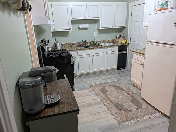Kitchen with granite countertops, brand new stove.