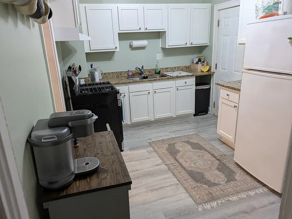 Kitchen with granite countertops, brand new stove.