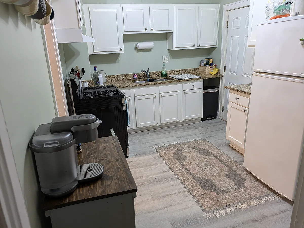 Kitchen with granite countertops, brand new stove. - 153 Line St #A