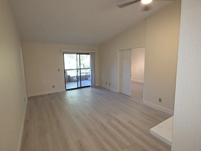 Livingroom looking toward patio sliders
