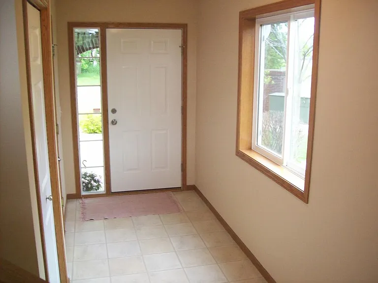 Entry way with coat closet (now has luxury vinyl plank flooring)