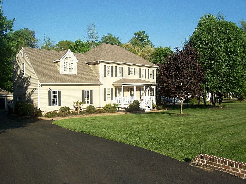 Custom two story Georgian Style Colonial, built in 1996 on .97 wooded acres