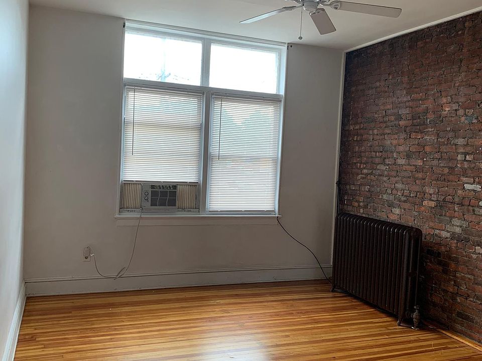 Living Space, Lots of natural light, exposed brick wall, wood floors