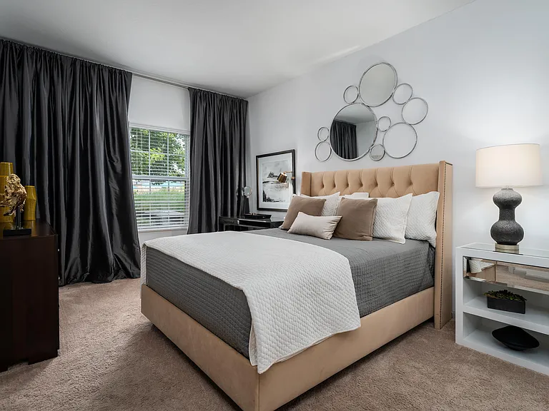 Unwind in a master bedroom designed for rest, comfort, and elevated style.