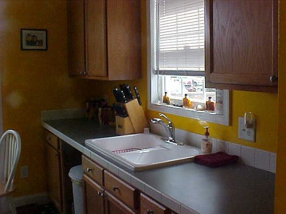 The kitchen overlooks the front yard and offers room for a breakfast area.