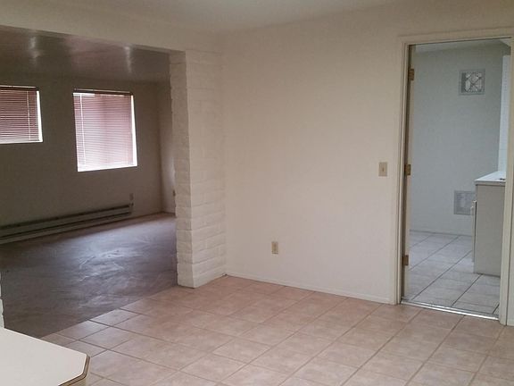 View from the kitchen. The family room is on the left, what is normally used as a dining room in the center, and laundry room to the right.