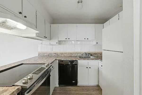 Kitchen with loads of cabinet, stove with a large oven