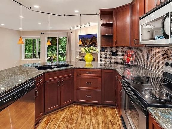 Oversized kitchen with custom cabinets and massive storage.