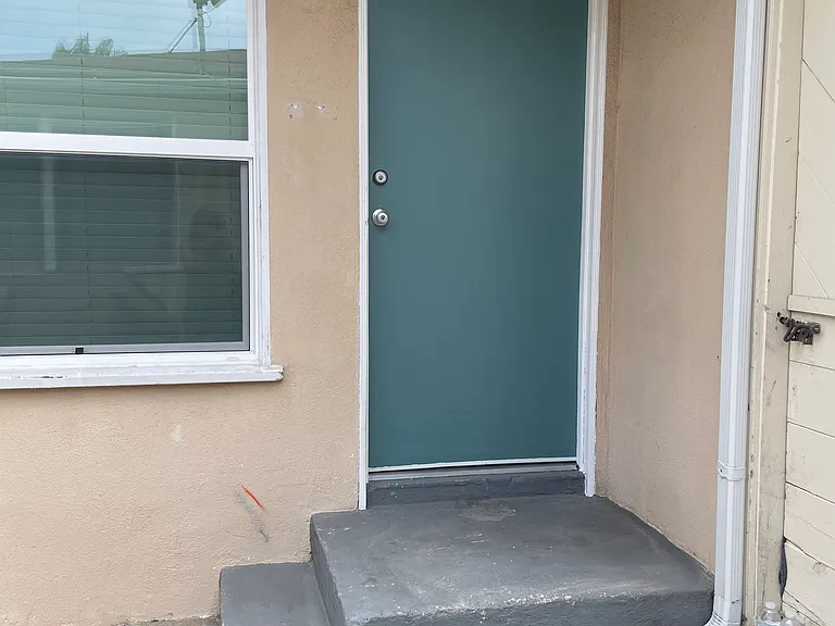 Back door entry next to single car garage