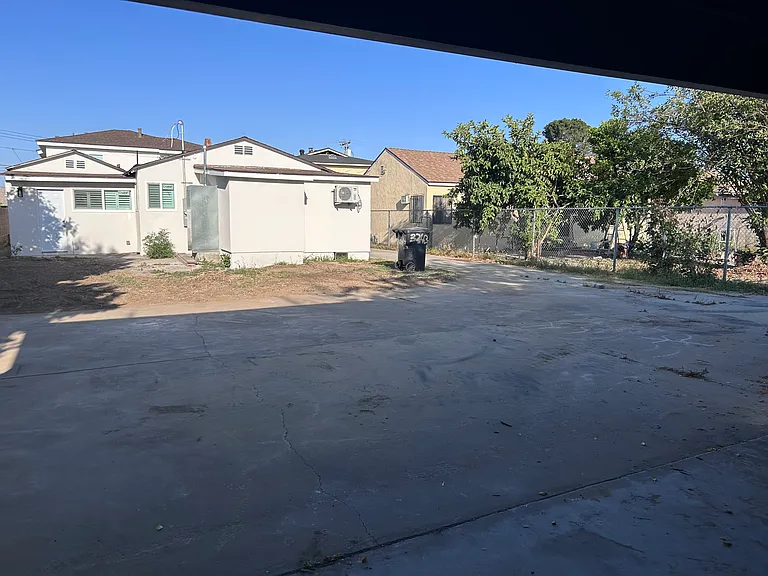 Shared parking space available in the back of the lot